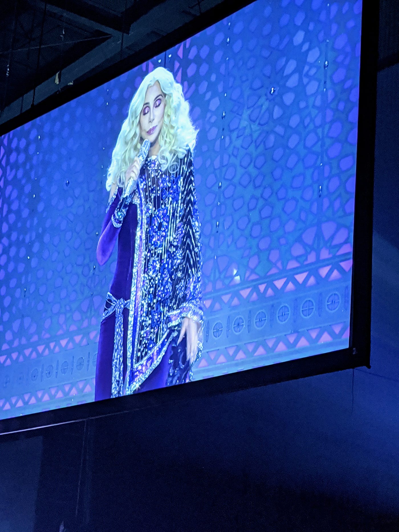Cher on the jumbotron at her last concert before the 2020 tour was cancelled
